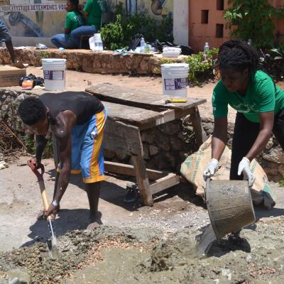 A volunteer helping to build a school at her Building Project placement A Projects Abroad volunteer helping to build a school at her Spring Break Building Project